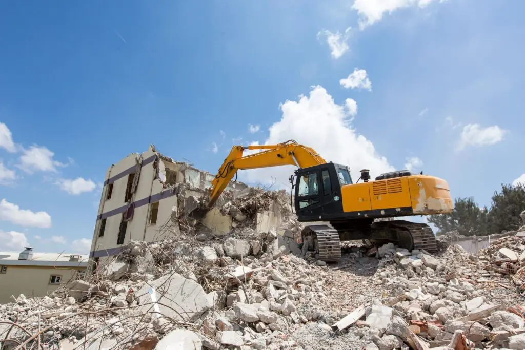 Construction crew performing residential demolition services to safely remove interior structures of a home.