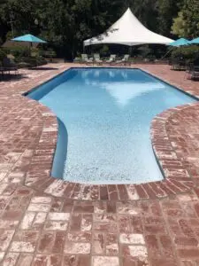 Pool with red brick coping and brick paver deck – Marin County