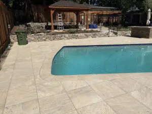 Pool with stone paver deck and wood pavilion – Marin County