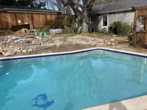 Pool renovation in progress with new stone retaining wall – Marin County