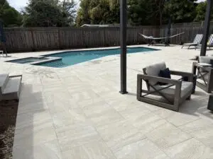 Large porcelain paver pool deck with lounge seating – Marin County