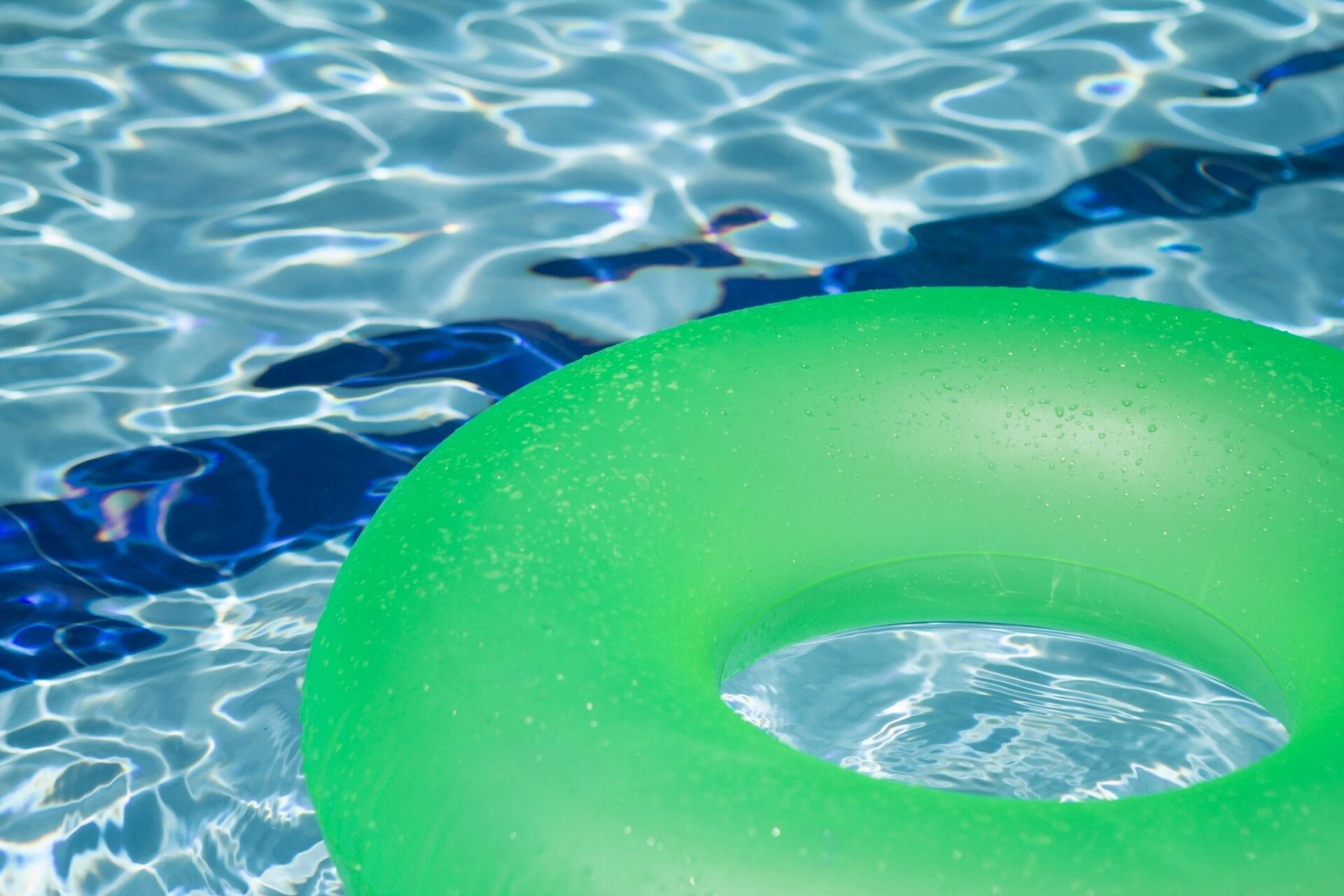 zoomed in image of a pool with a green float